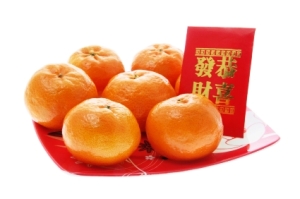 Mandarin and Red Packet on Isolated White Background